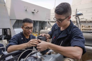 170208-N-JH293-012 SOUTH CHINA SEA (Feb. 8, 2017) At left, Electronics Technician 3rd Class Justin Tabios, from Foster City, California, and Electronics Technician Seaman Joshua Handegard, from Evansville, Indiana, install a global positioning system onto a small boat aboard the amphibious transport dock ship USS Green Bay (LPD 20). Green Bay, with embarked 31st Marine Expeditionary Unit, is on a routine patrol, operating in the Indo-Asia-Pacific region to enhance partnerships and be a ready-response force for any type of contingency. (U.S. Navy photo by Mass Communication Specialist 1st Class Chris Williamson/Released)