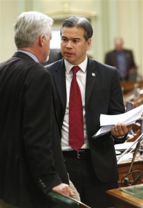 FILE -- In this April 4, 2013 file photo,  Assemblyman Rob Bonta, D-Oakland, right, talks with Assemblyman Wes Chesbro, D-Arcata at the Capitol in Sacramento, Calif.  By a 22-10 vote the state Senate approved Bonta's measure that would allow non-citizens to volunteer as poll workers, Monday, July 8, 2013.(AP Photo/Rich Pedroncelli, file)