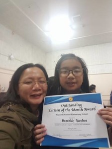 Arlene and Naneng receiving Citizen of the month award