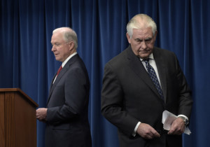 Attorney General Jeff Sessions, left, takes his turn to make a statement following Secretary of State Rex Tillerson, on issues related to visas and travel, Monday, March 6, 2017, at the U.S. Customs and Border Protection office in Washington. (AP Photo/Susan Walsh)