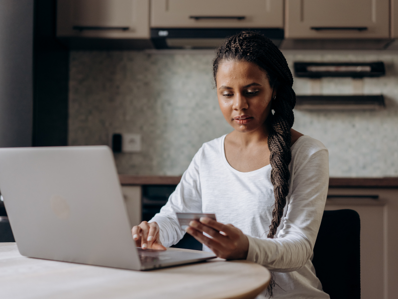 Person negotiating with credit card issuer for debt settlement