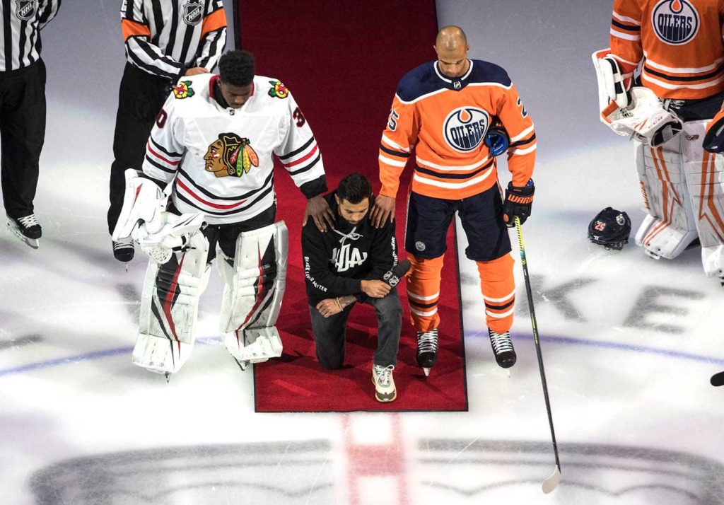 NHL player Matt Dumba gave an inspiring speech on racism and took the knee during the national anthem ahead of Saturday’s Blackhawks-Oilers game in Edmonton. AP PHOTO