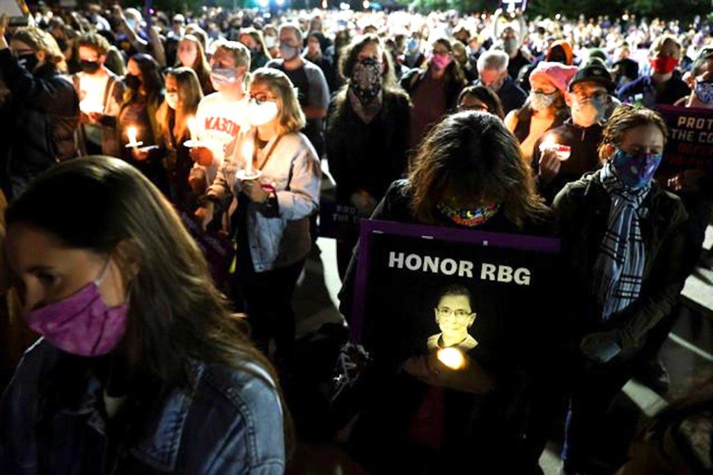 People gather outside the U.S. Supreme Court for a vigil following the death of U.S. Supreme Court Justice Ruth Bader Ginsburg in Washington, U.S., September 19, 2020. REUTERS/Jonathan Ernst