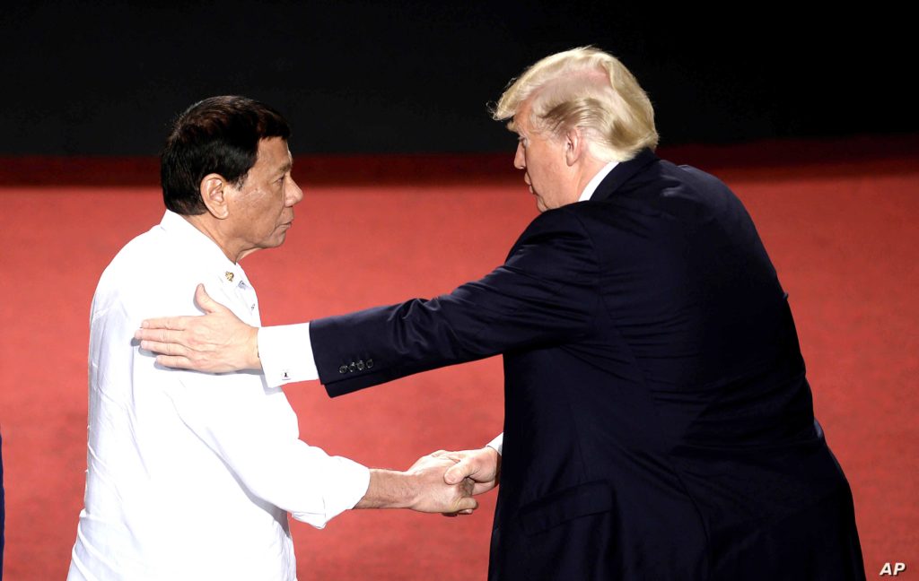 Philippines President Rodrigo Duterte, left, shakes hands with U.S. President Donald Trump during an ASEAN Summit, in Manila, Philippines, Nov. 13, 2017. AP