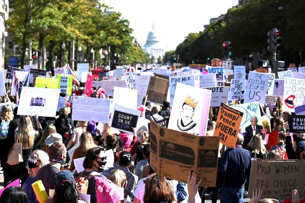  People participate in a nationwide protest against U.S. President Donald Trump's decision to fill the seat on the Supreme Court left by the passing of late Justice Ruth Bader Ginsburg before the 2020 election, in Washington, U.S., October 17, 2020. REUTERS/Erin Scott