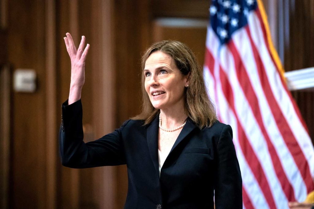 Judge Amy Coney Barrett, U.S. President Donald Trump's Nominee for Supreme Court, gestures during a photo before a meeting with Senator Roy Blunt (R-Mo) on Capitol Hill in Washington DC, U.S. October 21, 2020. Anna Moneymaker/Pool via REUTERS
