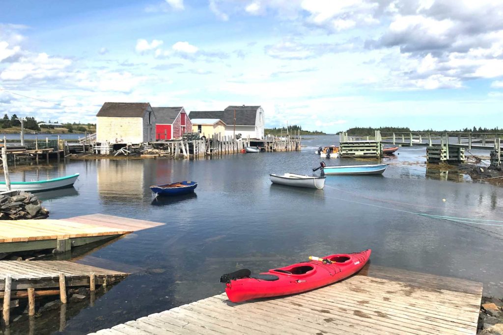 A red kayak is pictured on a dock in Blue Rocks, Nova Scotia, Canada, August 11, 2019. REUTERS/Carlo Allegri