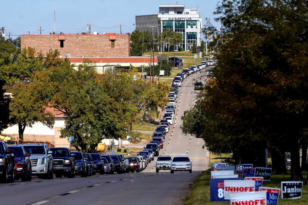 Voters wait in a long line of cars during early voting at the Oklahoma Election Board in Oklahoma City, Oklahoma, U.S. March 29, 2020. REUTERS/Nick Oxford