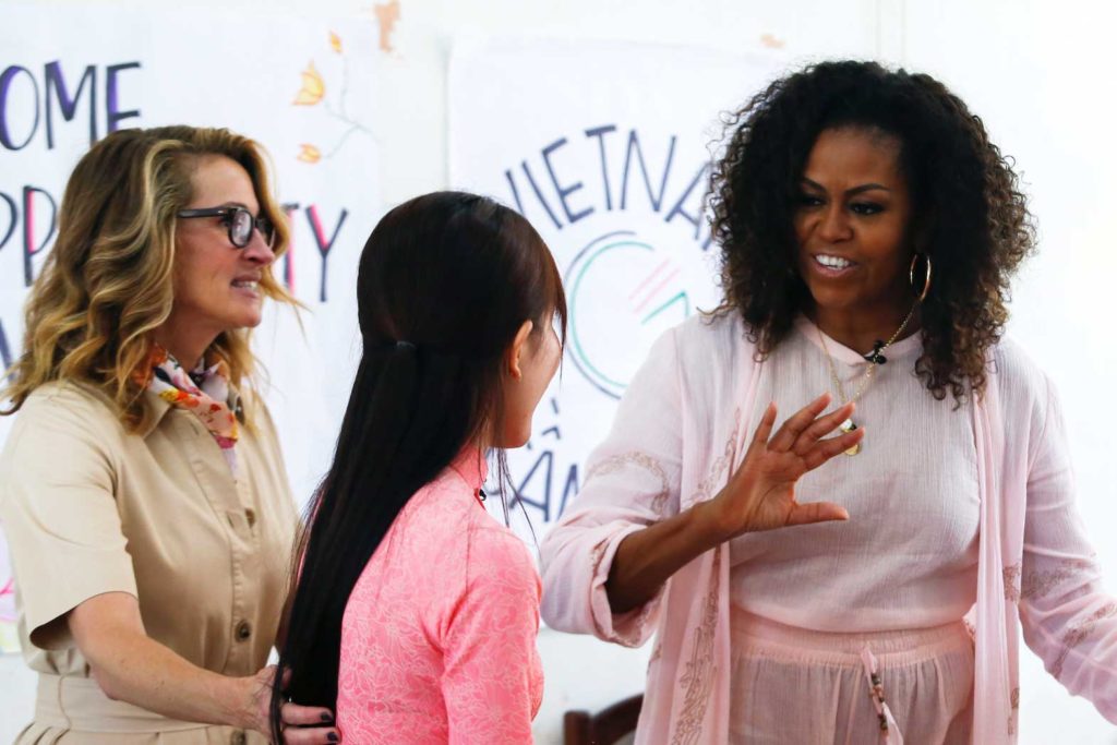 U.S. actor Julia Roberts and former first lady Michelle Obama attend the Girls Opportunity Alliance program with Room to Read at the Can Giuoc Highschool in Long An province, Vietnam, December 9, 2019. REUTERS/Yen Duong - RC2ORD9II8NQ
