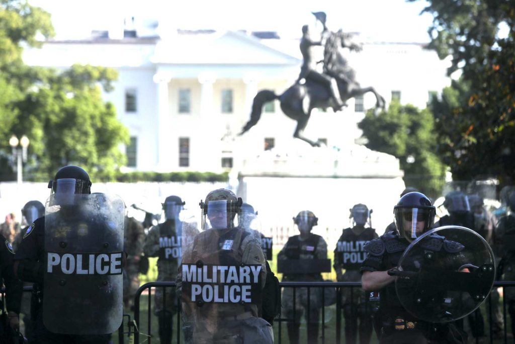 DC National Guard Military Police officers and law enforcement officers stand guard during a protests against the death in Minneapolis custody of George Floyd, near the White House in Washington, D.C., U.S., June 1, 2020. REUTERS/Jonathan Ernst/File Photo