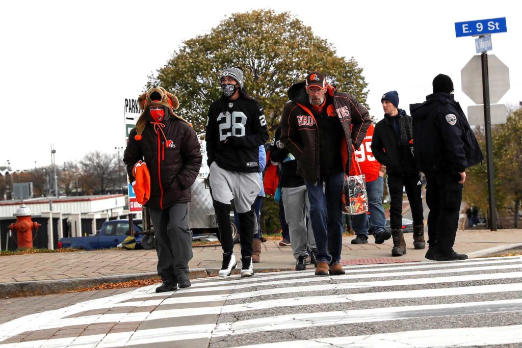 NFL football fans of the Cleveland Browns and Las Vegas Raiders wear protective face masks, as the coronavirus disease (COVID-19) outbreak continues, while attending their game at First Energy in Cleveland, Ohio, U.S., November 1, 2020. REUTERS/Shannon Stapleton