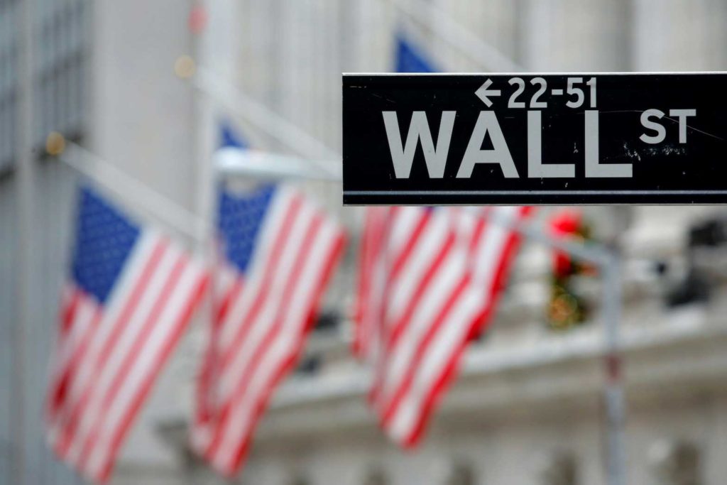  A street sign for Wall Street is seen outside the New York Stock Exchange (NYSE) in Manhattan, New York City, U.S. December 28, 2016. REUTERS/Andrew Kelly/File Photo