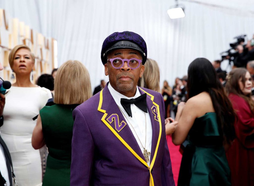   Director Spike Lee, wearing a coat with the number 24 in memory of NBA player Kobe Bryant, poses on the red carpet during the Oscars arrivals at the 92nd Academy Awards in Hollywood, Los Angeles, California, U.S., February 9, 2020. REUTERS/Mike Blake