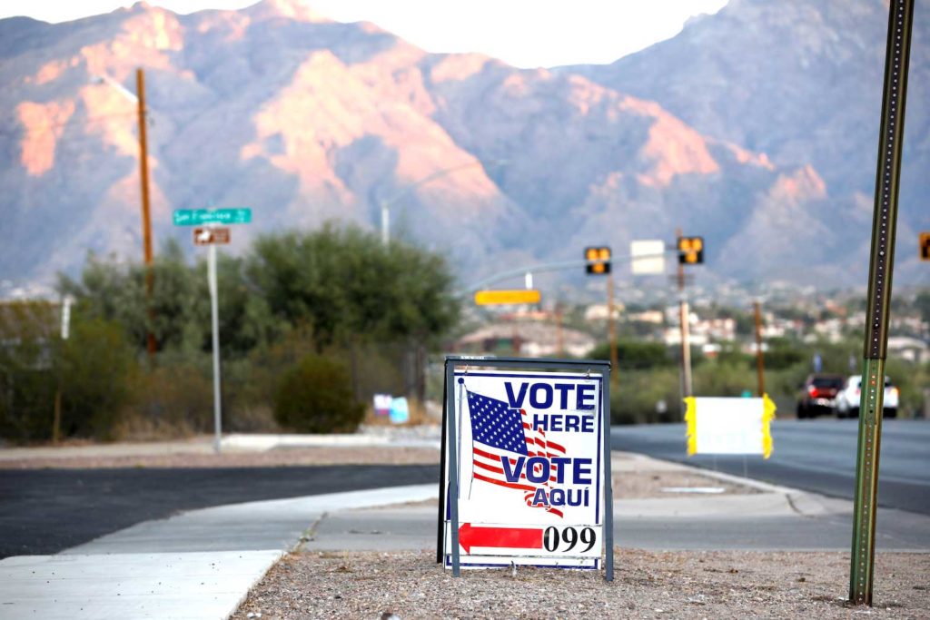 Sign directs voters to a polling station on Election Day in Tucson, Arizona, U.S. November 3, 2020. REUTERS/Cheney Orr