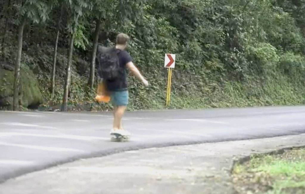 Skateboarder glides down a provincial road in Luzon. SCREENGRAB