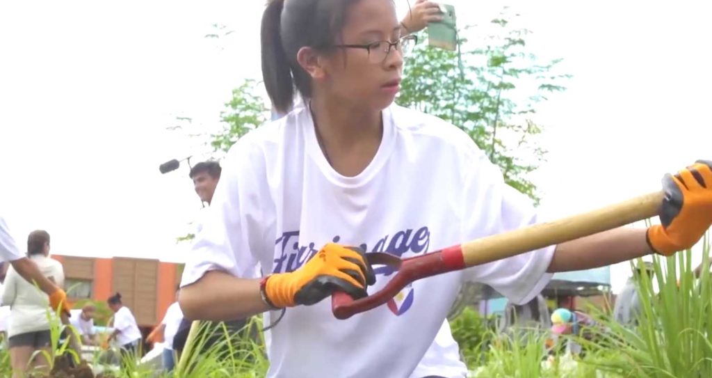 Students from The Filipino School in San Diego, California, help in clearing land during their visit to the Philippines. SCREEGRAB