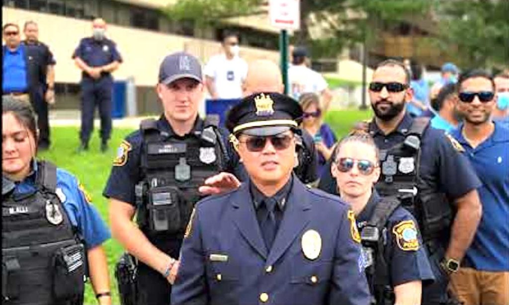 Sgt. Joseph Luistro (center) is credited with helping diversify Edison, New Jersey's police force. YOUTUBE