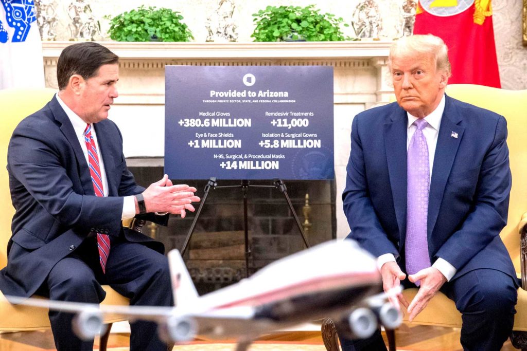 U.S. President Donald Trump meets with Arizona Governor Doug Ducey in the Oval Office of the White House in Washington, DC, U.S., August 5, 2020. Andrew Harnik/Pool via REUTERS