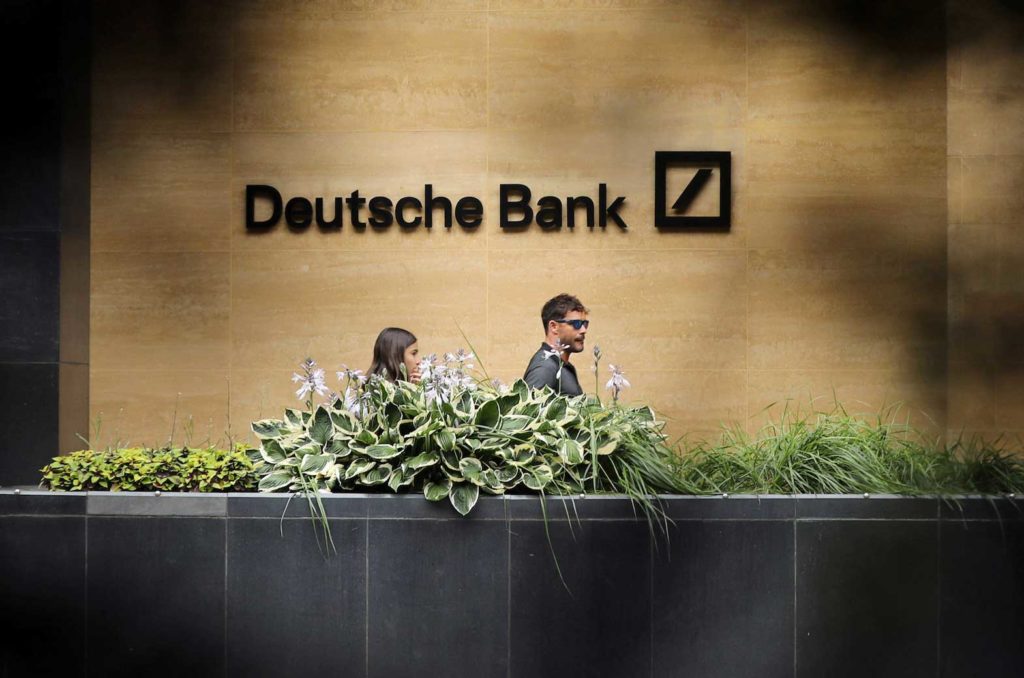 People walk past a Deutsche Bank office in London, Britain July 8, 2019. REUTERS/Simon Dawson