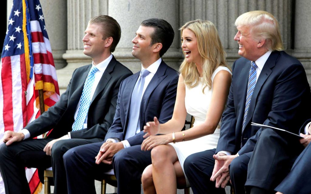  (L-R) Eric Trump, Donald Trump Jr., and Ivanka Trump and Donald Trump attend the ground breaking of the Trump International Hotel at the Old Post Office Building in Washington July 23, 2014. REUTERS/Gary Cameron//File Photo
