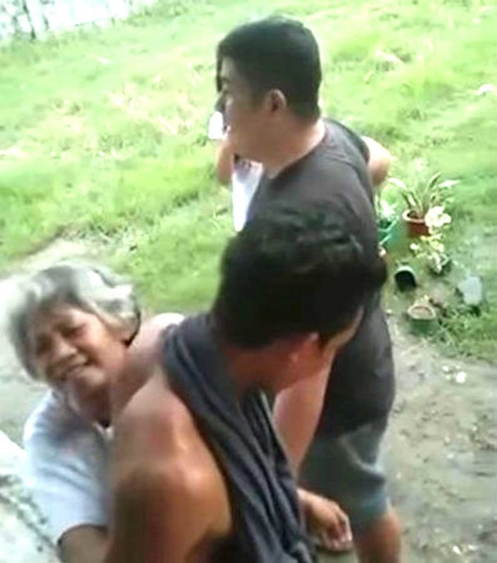 Sonya Gregorio hugs her son to restrain him just before police officer Jonel Nuezca (above) shot them in the head. SCREENSHOT