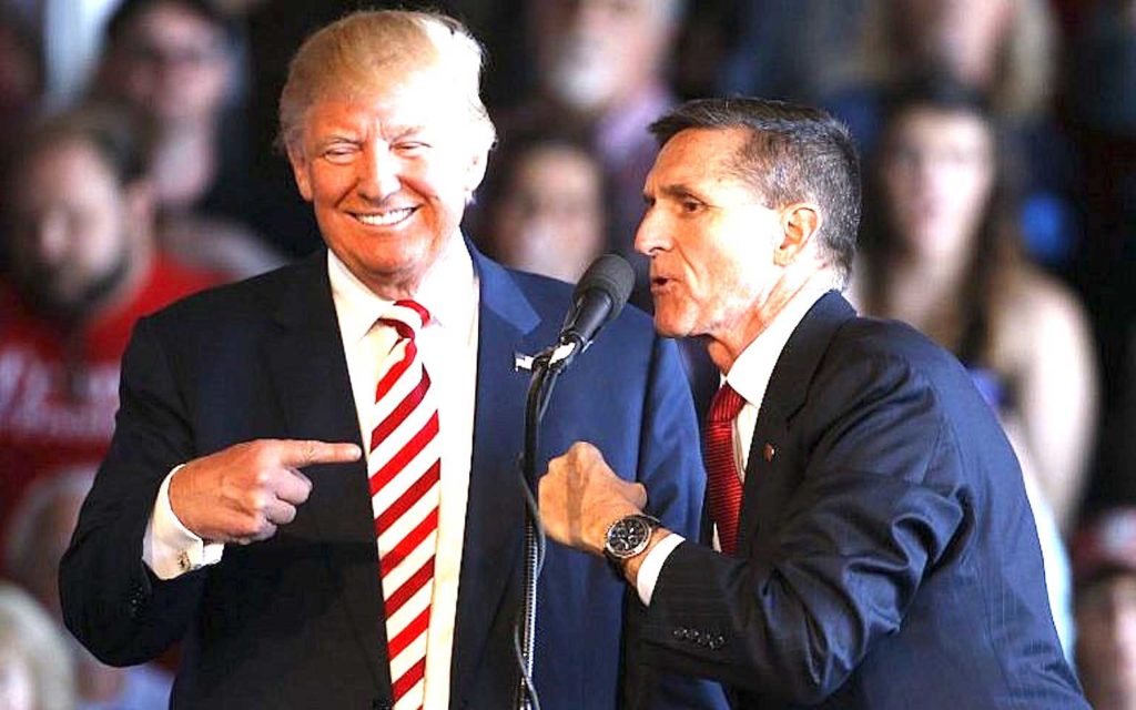 Pres. Trump with adviser Michael Flynn whom he pardoned. Flynn suggested Trump declare martial law to overturn the results of the recent presidential election. AFP