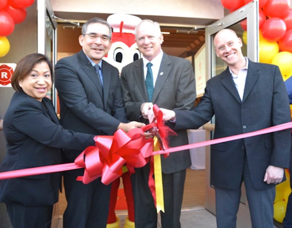 Maribeth Dela Cruz, President of Jollibee Group North America-Philippine Brands (left), at a branch opening. HANDOUT