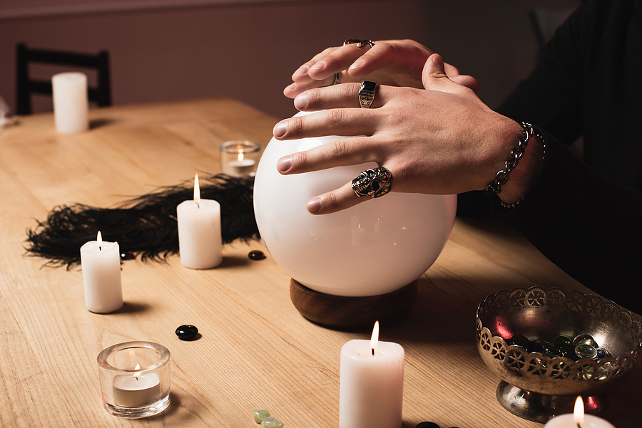 woman holding ball for a psychic reading