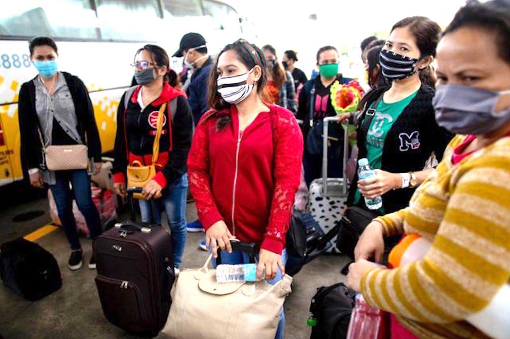 Repatriated Overseas Filipino Workers or OFWs arrive at an airport after being allowed to go home following weeks of quarantine amid the spread of the coronavirus disease (COVID-19), in Pasay City, Metro Manila, Philippines May 26, 2020. REUTERS/Eloisa Lopez