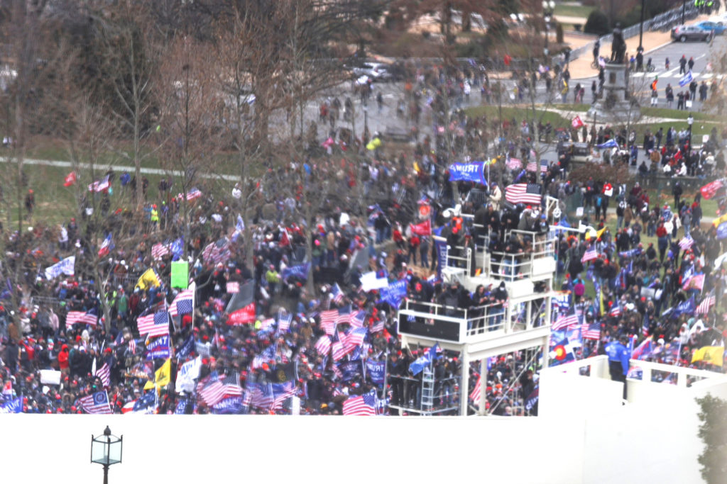 Supporters of U.S. President Donald Trump protest outside the U.S. Capitol, in Washington, U.S., January 6, 2021. Picture taken through a glass inside the Capitol. REUTERS/Jonathan Ernst
