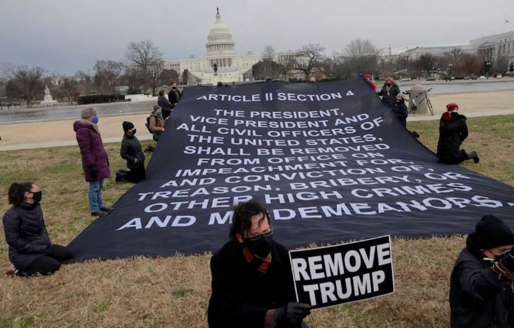 Demonstrators gather in the foreground of the U.S. Capitol days after supporters of U.S. President Donald Trump stormed the Capitol building in Washington, U.S., January 8, 2021. REUTERS/Leah Millis
