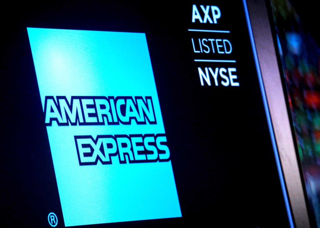  American Express logo and trading symbol are displayed on a screen at the New York Stock Exchange (NYSE) in New York, U.S., December 6, 2017. REUTERS/Brendan McDermid