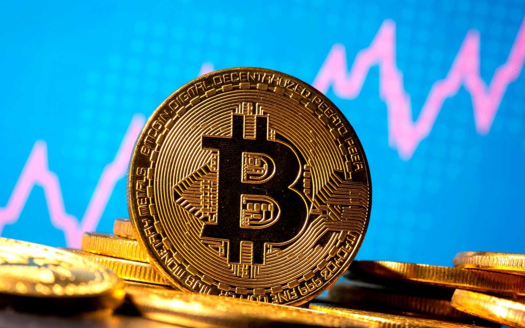  A representation of virtual currency Bitcoin is seen in front of a stock graph in this illustration taken November 19, 2020. REUTERS/Dado Ruvic