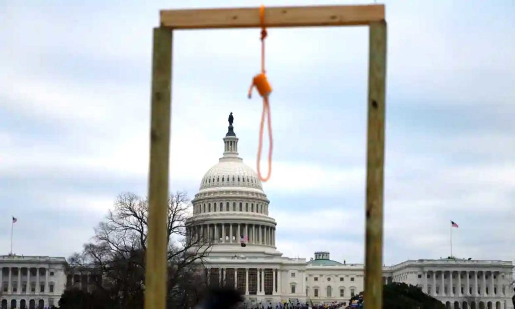 A noose is seen on makeshift gallows as supporters of Donald Trump gather outside the Capitol.  Andrew Caballero-Reynolds/AFP