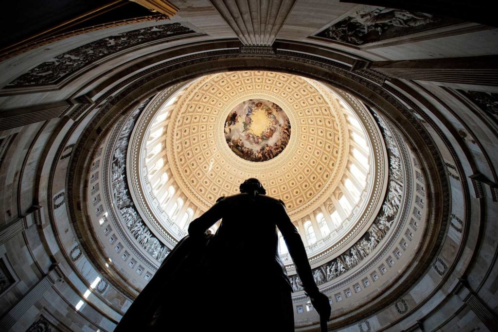 Rotunda of the U.S. Capitol is seen behind a statue of former President George Washington, before the second impeachment trial for former President Donald Trump, at the Capitol in Washington, U.S., February 9, 2021. REUTERS/Al Drago