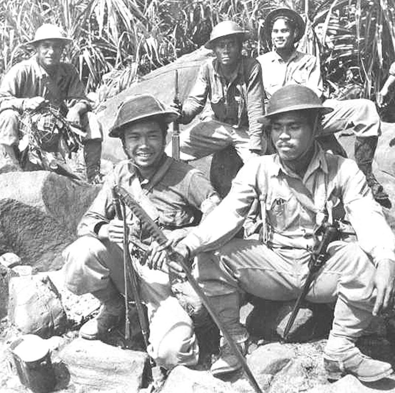Filipino soldiers during WWII with a captured Japanese saber.