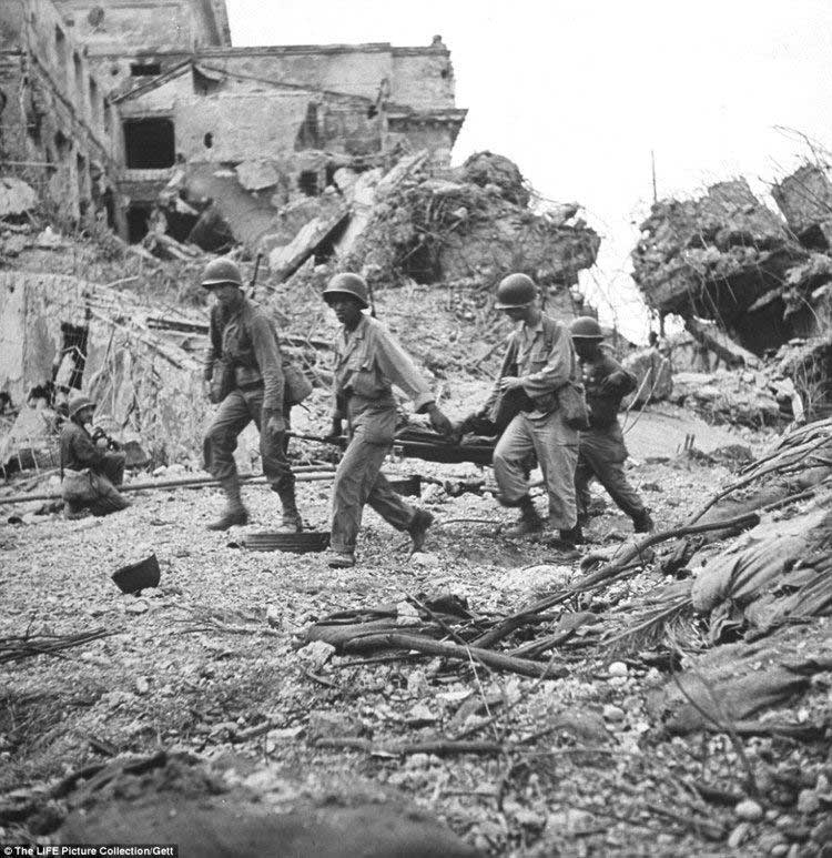 American G.I.s picking their way through the ruins after the Battle of Manila in 1945. FILE PHOTO