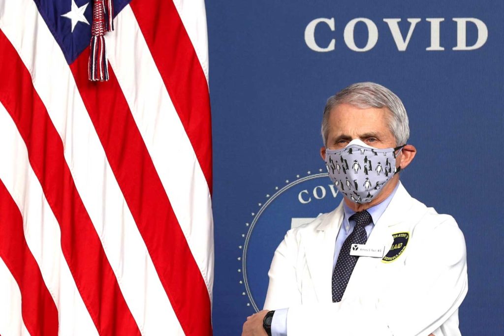 National Institute of Allergy and Infectious Diseases Director Dr. Anthony Fauci stands by during an event to commemorate the 50 millionth coronavirus disease (COVID-19) vaccination in the South Court Auditorium at the White House in Washington, U.S., February 25, 2021. REUTERS/Jonathan Ernst