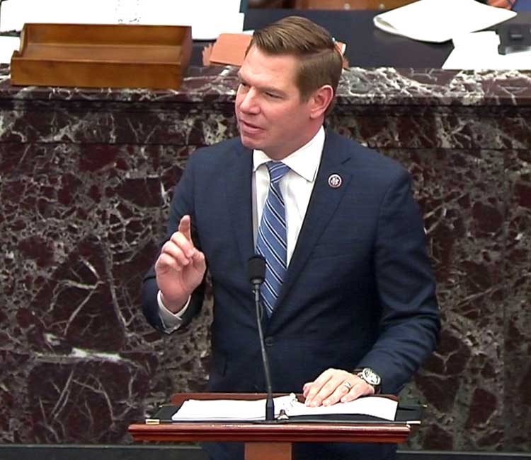   U.S. House impeachment manager Rep. Eric Swalwell (D-CA) delivers part of the impeachment managers’ opening argument in the impeachment trial of former President Donald Trump on charges of inciting the deadly attack on the U.S. Capitol, on the floor of the Senate chamber on Capitol Hill in Washington, U.S., February 10, 2021. U.S. Senate TV/Handout via Reuters