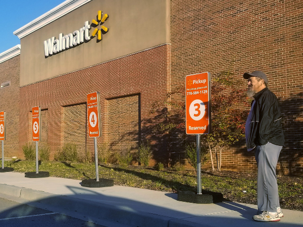 Jeff Leonard, a DoorDash driver, waits to pickup an order at a Walmart online grocery pickup parking lot in Cumming, Georgia, U.S., November 5, 2018. REUTERS/Nandita Bose