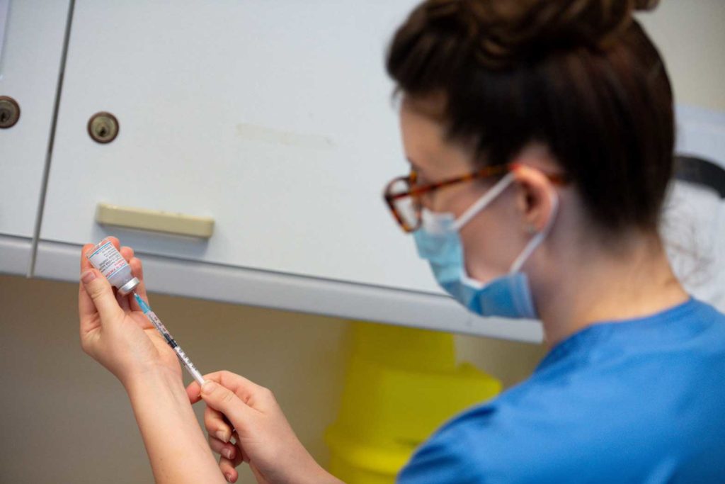 A nurse prepares a dose of the Moderna coronavirus disease (COVID-19) vaccine at the Glangwili General Hospital in Carmarthen, Wales, Britain April 7, 2021. Jacob King/Pool via REUTERS