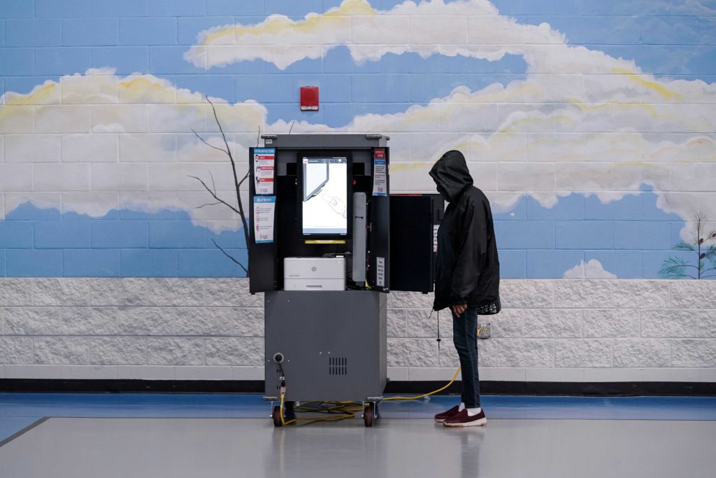  A voter casts ballot in Georgia’s Senate runoff elections at a Fulton County polling station in Atlanta, Georgia, U.S. January 5, 2021. 
