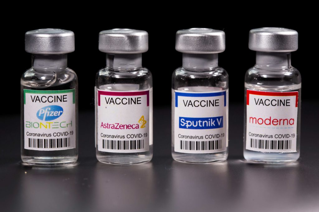 Vials with Pfizer-BioNTech, AstraZeneca, Sputnik V, and Moderna coronavirus disease (COVID-19) vaccine labels are seen in this illustration picture taken March 19, 2021. REUTERS/Dado Ruvic/Illustration