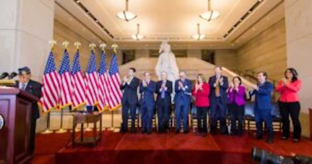 Congressional leaders give a standing ovation to Filipino World War II Veteran Celestino Almeda who received the Congressional Gold Medal on behalf of his comrades, at an awards ceremony on Oct. 25, 2017.