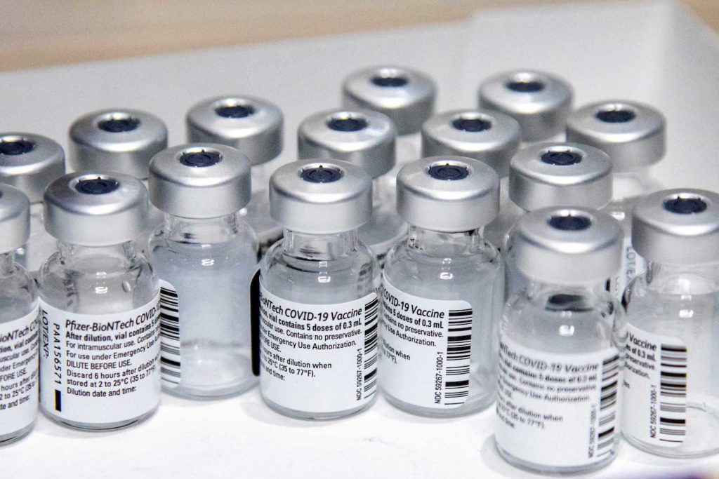  Empty vials of the Pfizer-BioNTech coronavirus disease (COVID-19) vaccine are seen at The Michener Institute, in Toronto, Canada January 4, 2021. REUTERS/Carlos Osorio/File Photo