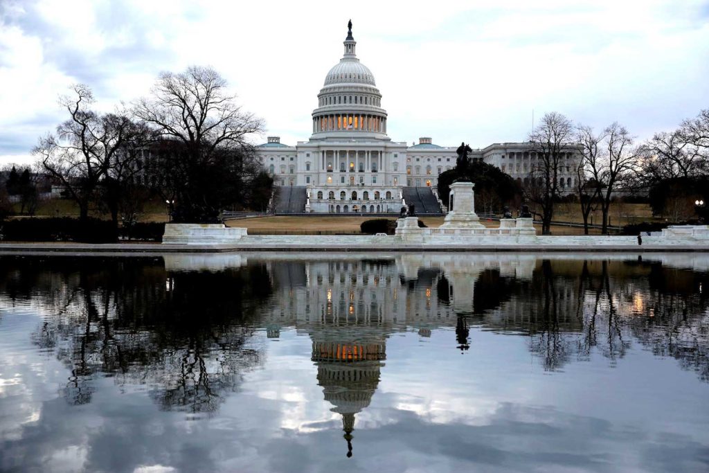  Clouds pass over the U.S. Capitol in Washington, U.S., January 22, 2018. REUTERS/Joshua Roberts/File Photo