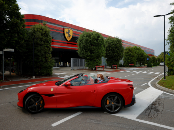 Ferrari woos customers as it flaunts its latest models on the catwalk