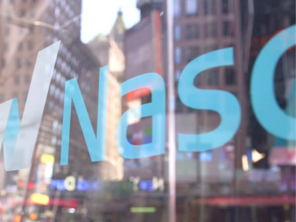 Nasdaq closes up on tech stocks strength as hawkish Fed limits S&P
