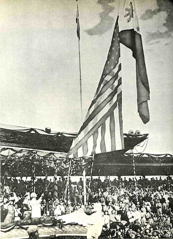    The Flag of the United States is lowered while the Flag of the Philippines is being raised during independence ceremonies, July 4, 1946.