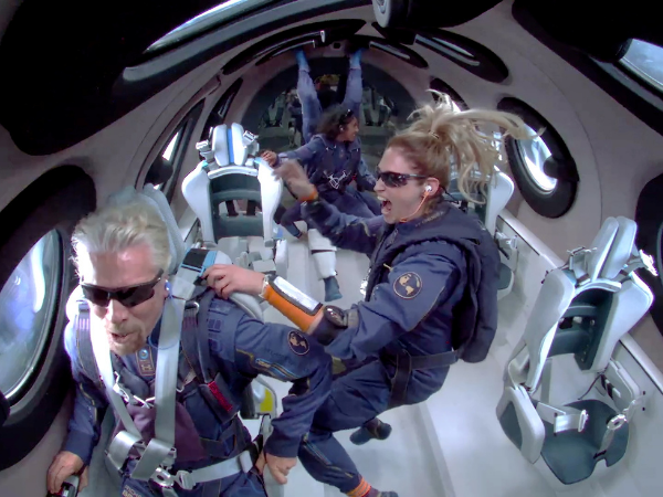 Aboard Virgin Galactic, billionaire soars to space on his first flight